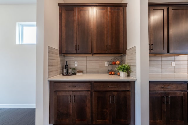 43547 Bolingbrooke Ln, Novi, MI 48377 - bar featuring tasteful backsplash, baseboards, and wood finished floors