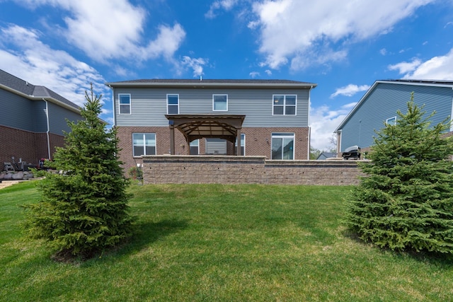 43547 Bolingbrooke Ln, Novi, MI 48377 - back of property with brick siding, a gazebo, and a lawn