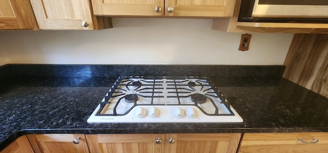 5608 Clifford St, Topinabee, MI 49791 - kitchen view of white gas stovetop and dark countertops