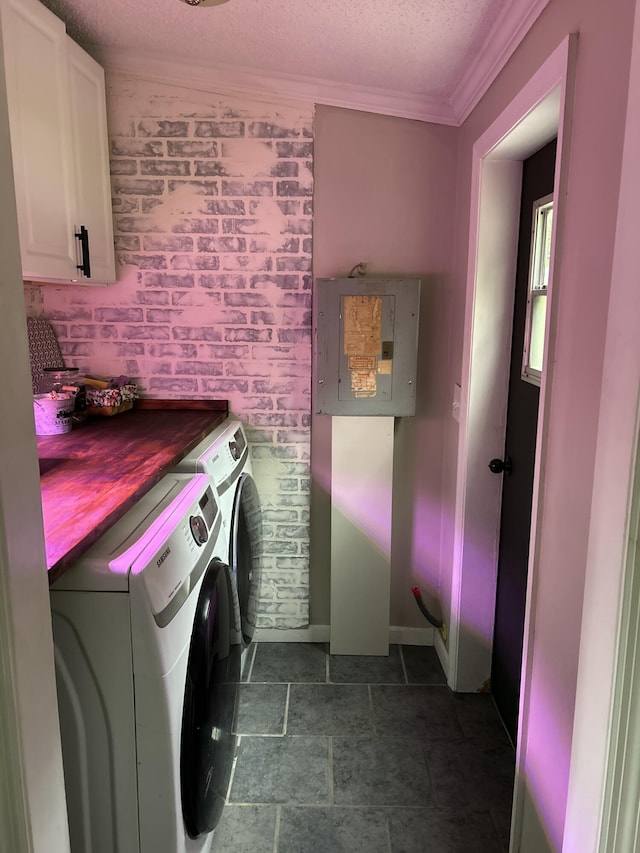11005 Elm Ave, Howard City, MI 49329 - clothes washing area with washing machine and dryer, electric panel, cabinet space, ornamental molding, and a textured ceiling