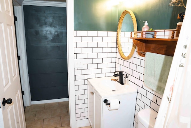 11005 Elm Ave, Howard City, MI 49329 - bathroom with tile walls, vanity, tile patterned floors, and toilet
