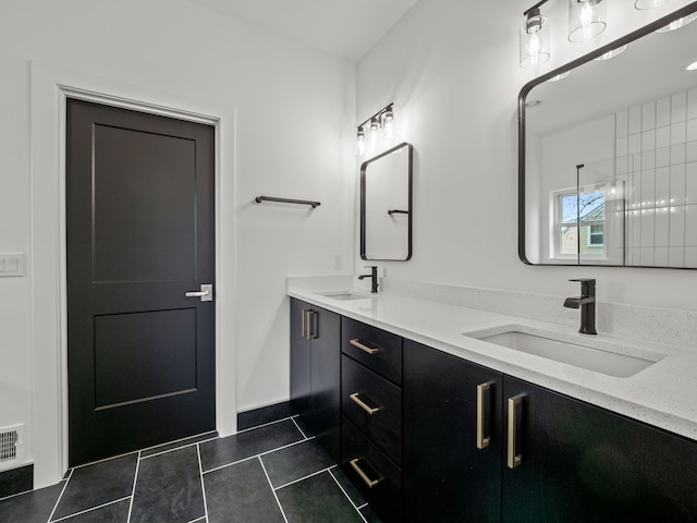 bathroom with tile patterned flooring and double vanity