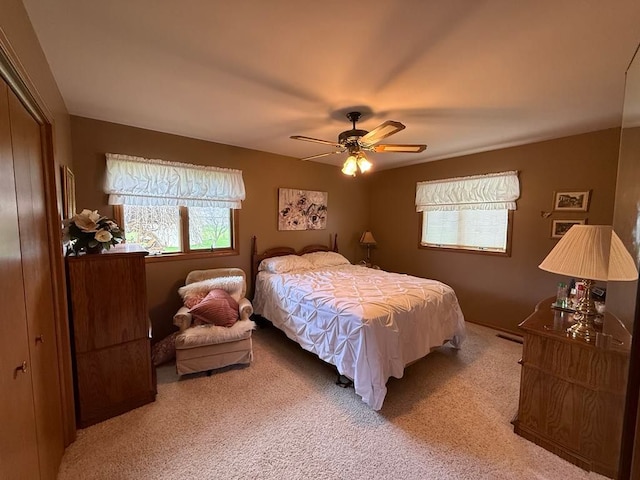 275 Madison St, Port Austin, MI 48467 - bedroom featuring a ceiling fan, a closet, and carpet