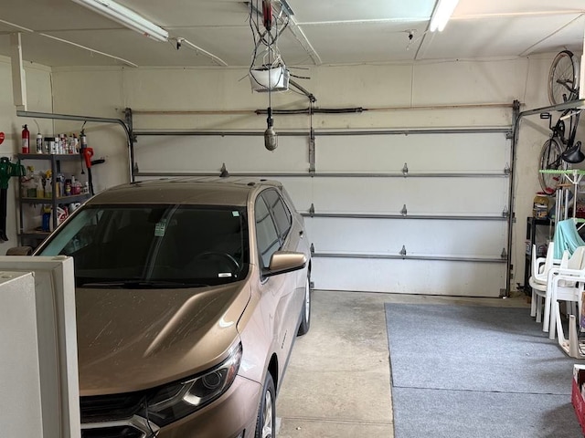275 Madison St, Port Austin, MI 48467 - garage featuring a garage door opener