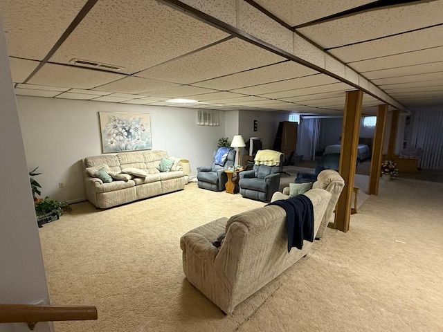 275 Madison St, Port Austin, MI 48467 - carpeted living room featuring a drop ceiling and visible vents