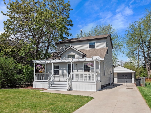 traditional-style home with covered porch, a garage, a shingled roof, a front yard, and a gate
