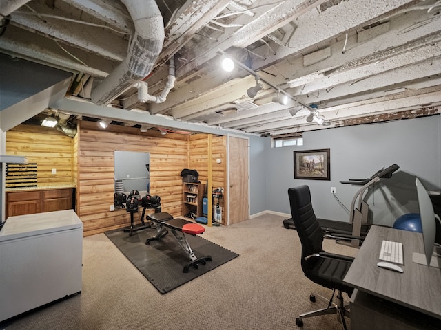workout area with carpet flooring and baseboards