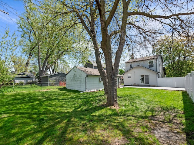 view of yard with a patio area and a fenced backyard