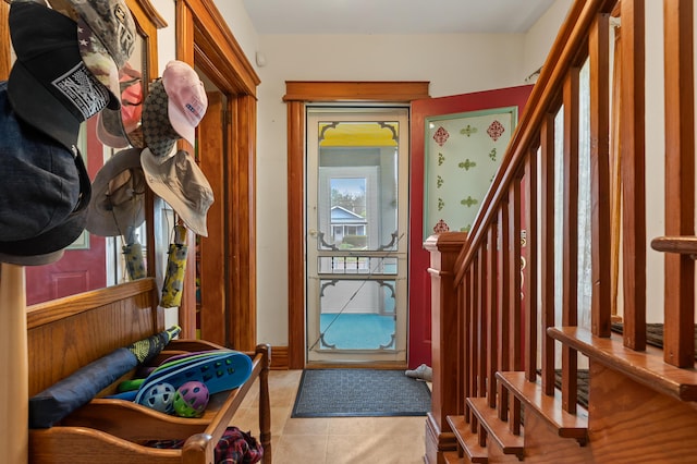 foyer with tile patterned floors and stairway