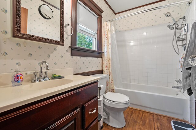 full bath with toilet, shower / tub combo, wallpapered walls, and wood finished floors