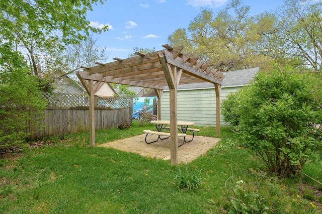 view of yard with a pergola, fence, and a patio area