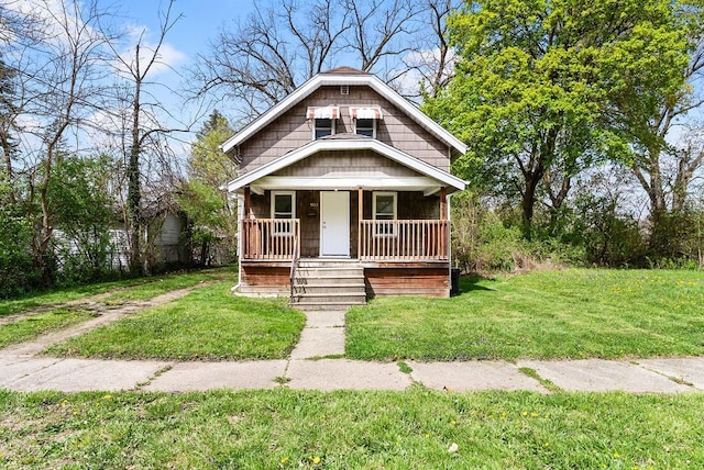 5011 Baldwin Blvd, Flint, MI 48505 - bungalow-style house with a front yard and covered porch