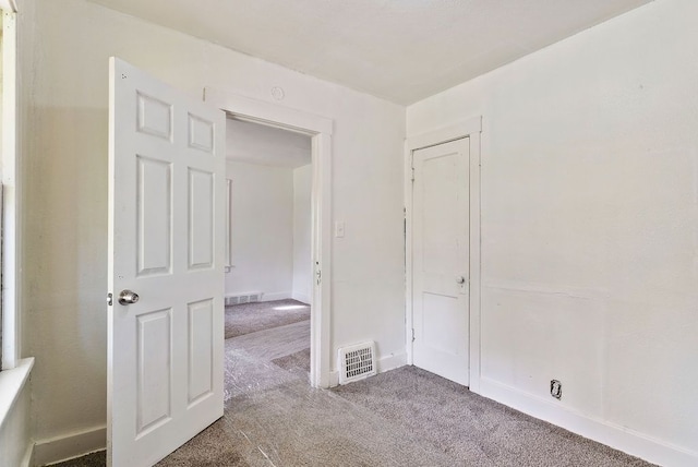 5011 Baldwin Blvd, Flint, MI 48505 - carpeted empty room with baseboards and visible vents