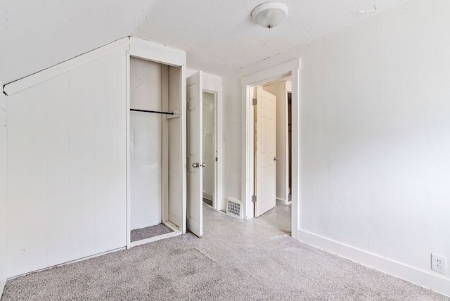 5011 Baldwin Blvd, Flint, MI 48505 - unfurnished bedroom with baseboards, visible vents, and carpet floors