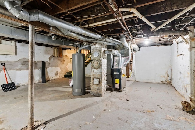 5011 Baldwin Blvd, Flint, MI 48505 - unfinished below grade area with gas water heater and heating unit