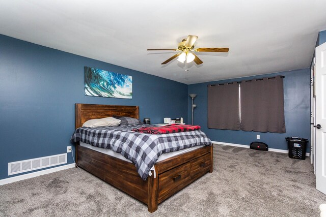 bedroom featuring carpet, visible vents, baseboards, and ceiling fan