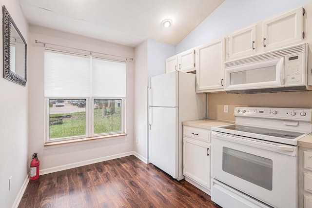 kitchen with white cabinetry, dark wood-type flooring, white appliances, light countertops, and lofted ceiling