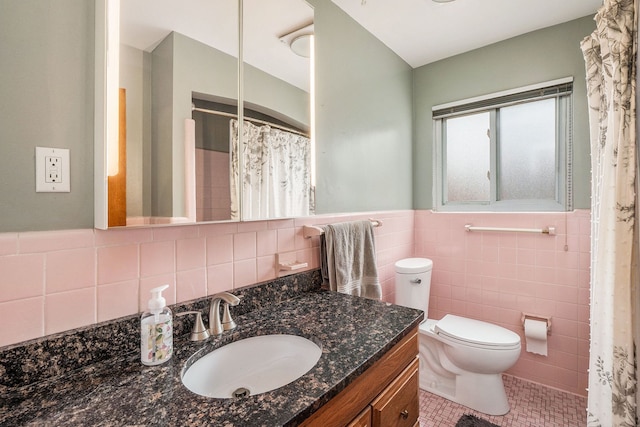 8458 Francine St, Warren, MI 48093 - bathroom featuring tile walls, tile patterned flooring, toilet, vanity, and wainscoting