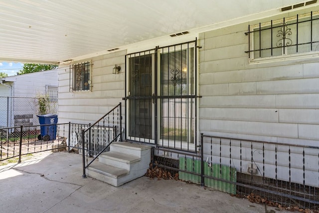 property entrance with fence