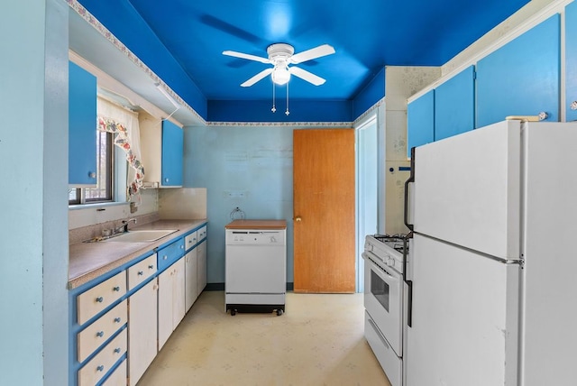 kitchen featuring white appliances, a sink, ceiling fan, finished concrete flooring, and light countertops