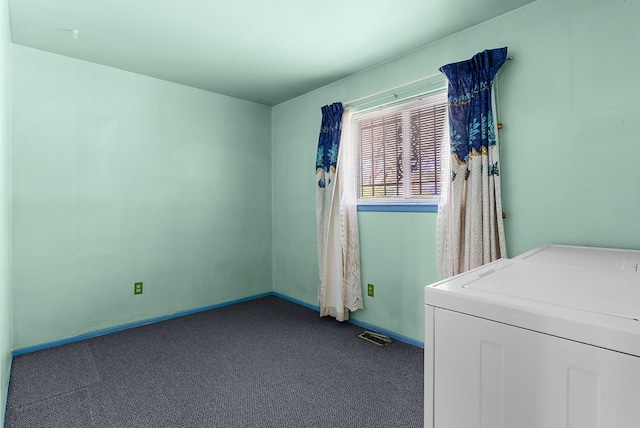 laundry room featuring washer / dryer, dark carpet, and baseboards
