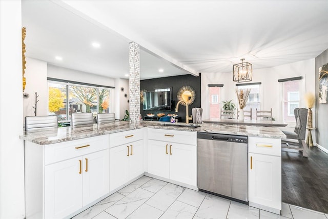 kitchen featuring plenty of natural light, a sink, recessed lighting, and stainless steel dishwasher