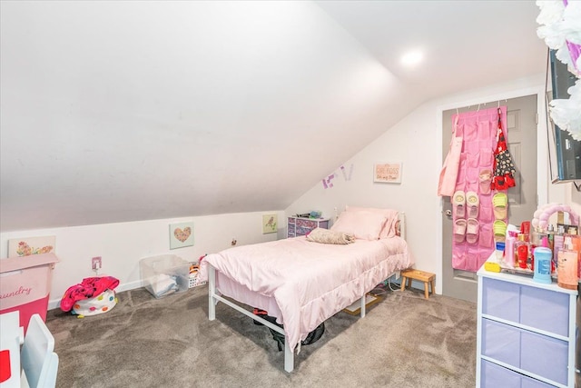 bedroom featuring lofted ceiling and carpet flooring
