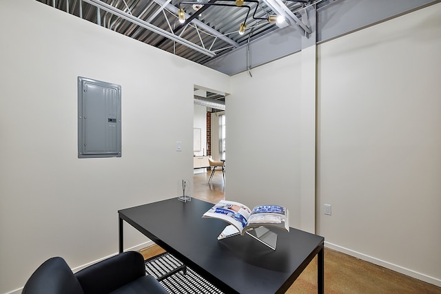 office with baseboards and electric panel