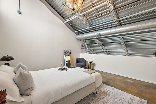 bedroom with baseboards, an inviting chandelier, and finished concrete floors