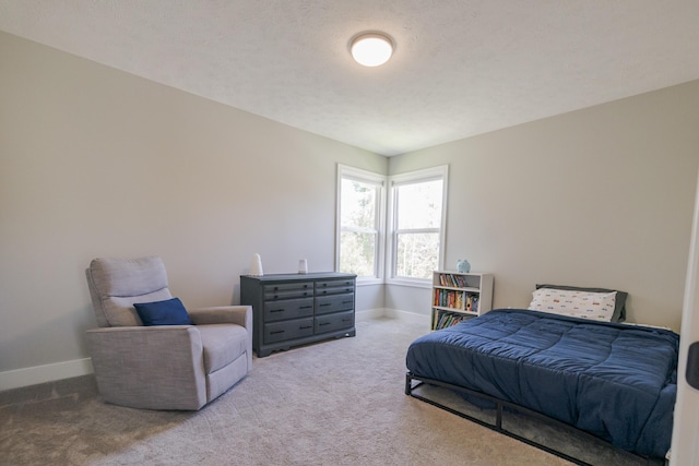 carpeted bedroom with baseboards