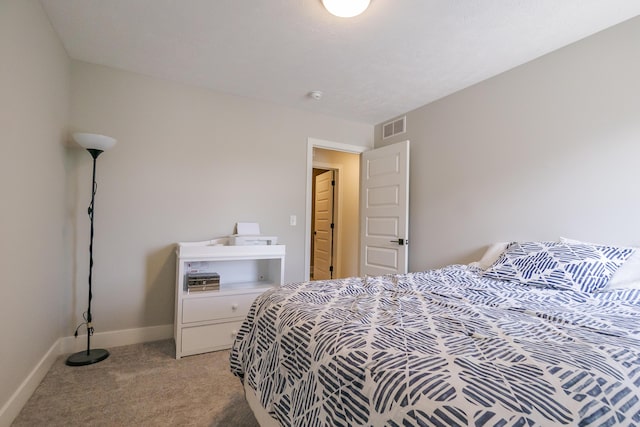 bedroom featuring light carpet, baseboards, and visible vents