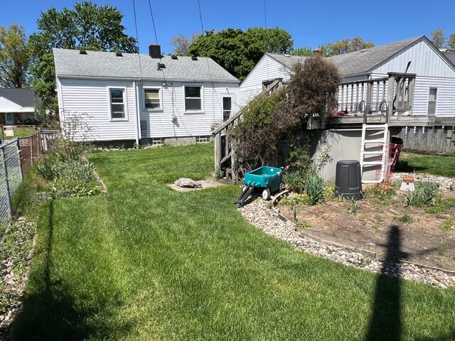 1452 E Madge Ave, Hazel Park, MI 48030 - rear view of property featuring stairs, a wooden deck, and roof with shingles