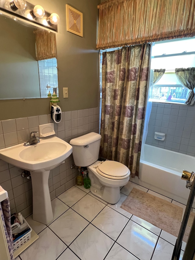 1452 E Madge Ave, Hazel Park, MI 48030 - full bath featuring tile walls, toilet, wainscoting, shower / tub combo with curtain, and tile patterned floors