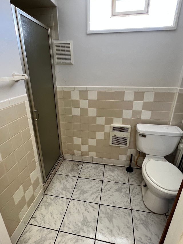1452 E Madge Ave, Hazel Park, MI 48030 - full bathroom featuring tile walls, wainscoting, toilet, a shower stall, and heating unit
