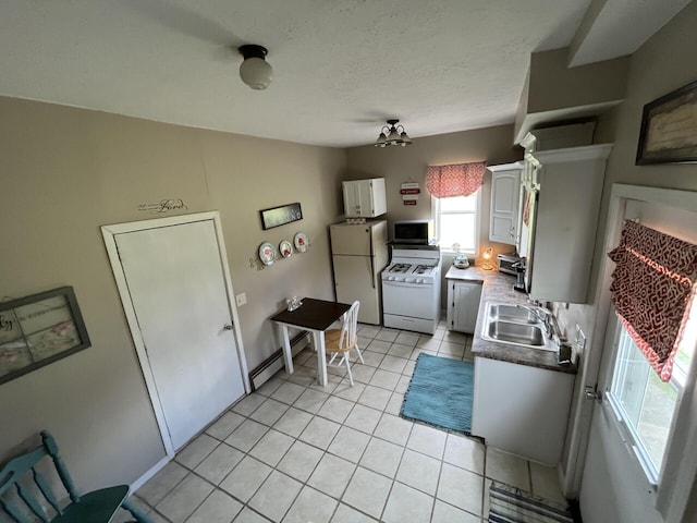 kitchen featuring a sink, white cabinetry, white appliances, light tile patterned flooring, and a baseboard radiator