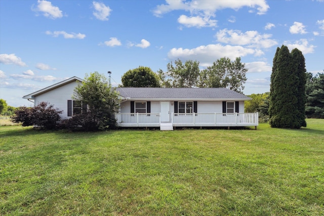 ranch-style home with a wooden deck and a front yard