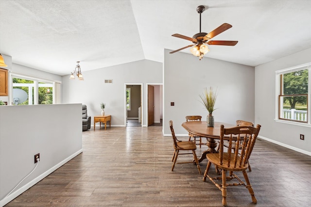 dining room with lofted ceiling, dark wood-style floors, visible vents, and plenty of natural light