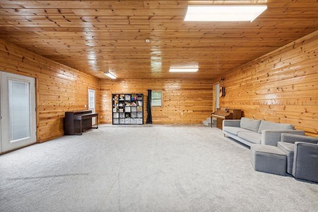 living area featuring carpet, wooden ceiling, and wood walls