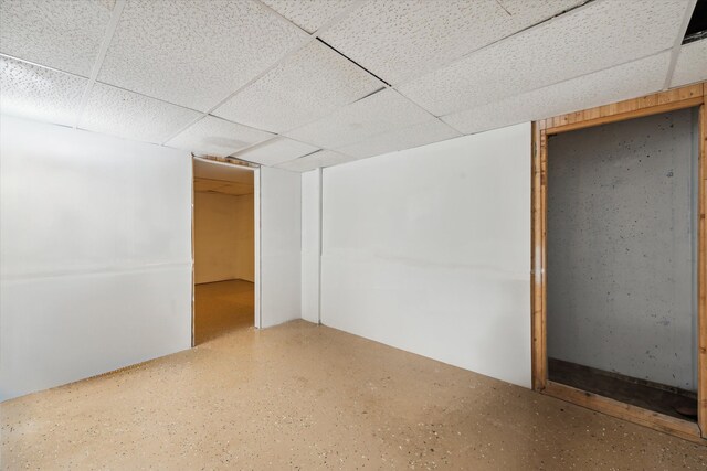 spare room featuring a drop ceiling