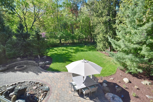 1256 Lenhill Ct, Bloomfield Hills, MI 48304 - view of grassy yard with a fire pit, a patio area, and outdoor dining space