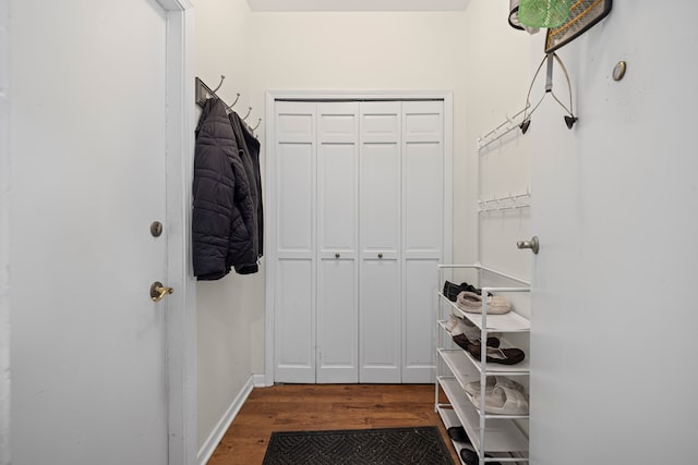 mudroom with baseboards and wood finished floors