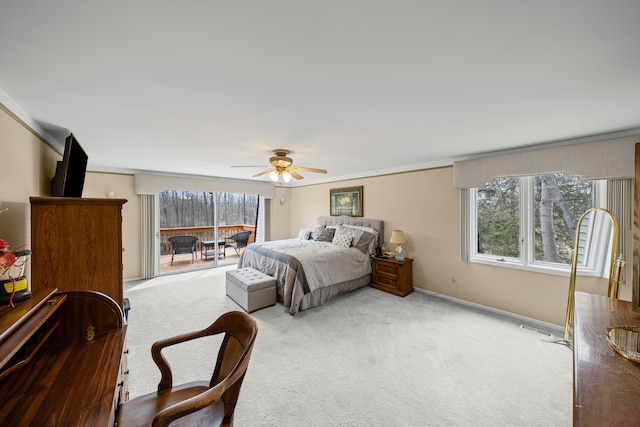 bedroom with carpet flooring, multiple windows, visible vents, and a ceiling fan