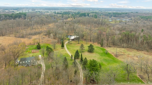 drone / aerial view with a view of trees