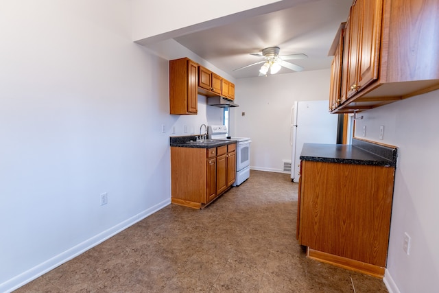 kitchen featuring a sink, brown cabinetry, white appliances, under cabinet range hood, and a ceiling fan