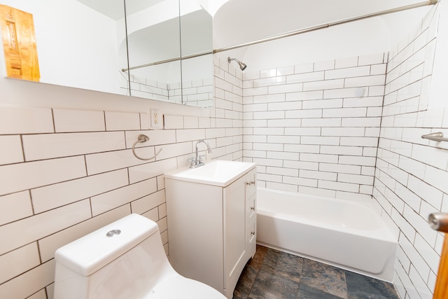 full bath featuring tile walls, toilet, vanity, decorative backsplash, and tub / shower combination