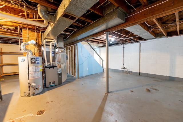 unfinished below grade area with heating unit and gas water heater