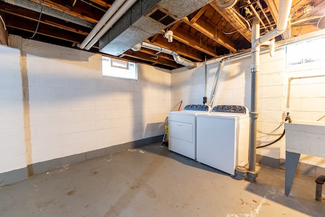 below grade area with washer and clothes dryer and visible vents