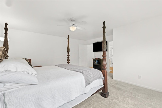 bedroom featuring light carpet, ceiling fan, and baseboards