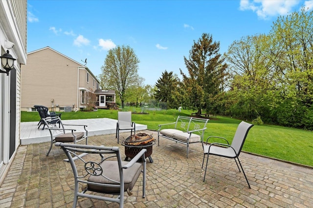 view of patio with an outdoor fire pit