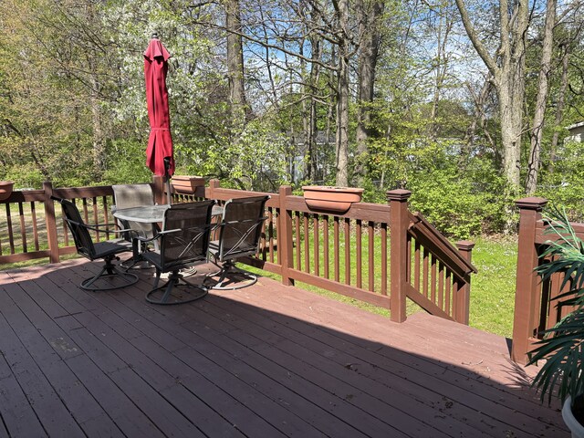 wooden terrace featuring outdoor dining space